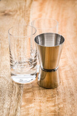 shot glass with a silver shot measure