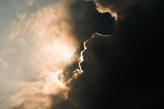 Rays Of Light Shining Through Dark Clouds