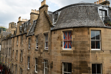 the union jack flag of the united kingdom on display in the window of a house in Victoria Street edinburgh scotland during times of talk about separation from britain - obrazy, fototapety, plakaty
