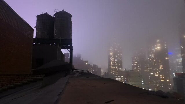 Rooftop with water tower and city views