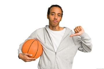 Young african american man playing basketball isolated showing a dislike gesture, thumbs down....
