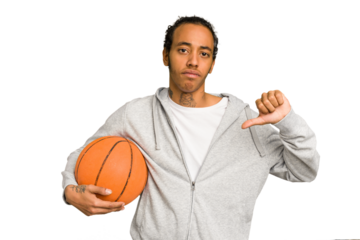 Young african american man playing basketball isolated showing a dislike gesture, thumbs down. Disagreement concept.