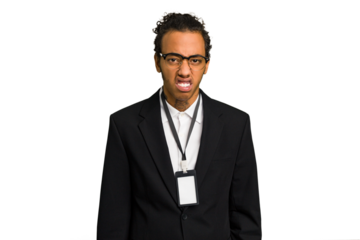 Young African American business man with badge isolated screaming very angry and aggressive.
