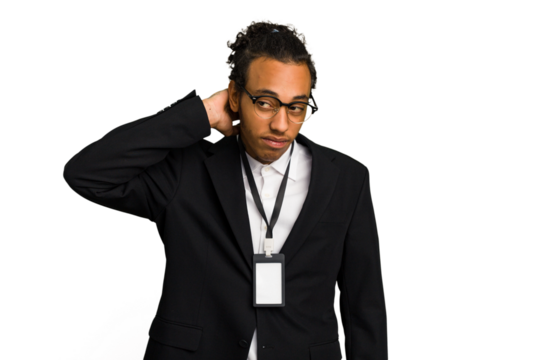 Young African American business man with badge isolated touching back of head, thinking and making a choice.
