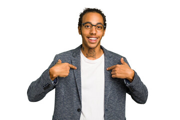 Young African American man isolated surprised pointing with finger, smiling broadly.