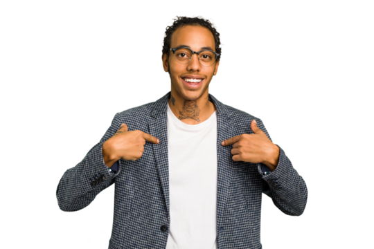 Young African American man isolated surprised pointing with finger, smiling broadly.