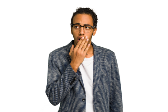 Young African American man isolated yawning showing a tired gesture covering mouth with hand.