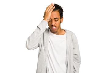 Young African American man isolated forgetting something, slapping forehead with palm and closing eyes.