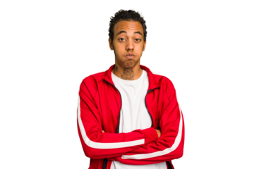 Young African American man isolated blows cheeks, has tired expression. Facial expression concept.