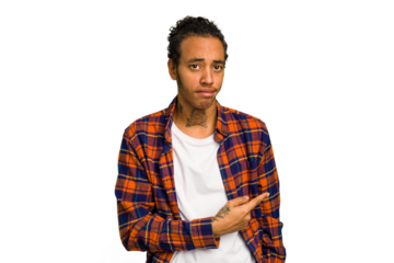 Young African American man isolated smiling and pointing aside, showing something at blank space.