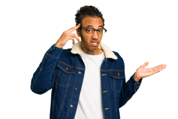 Young African American man isolated showing a disappointment gesture with forefinger.