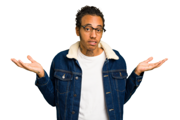 Young African American man isolated doubting and shrugging shoulders in questioning gesture.
