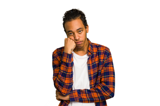 Young African American man isolated who feels sad and pensive, looking at copy space.