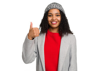 Young african american woman wearing winter jacket isolated smiling and raising thumb up