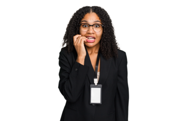 Young african american business woman with ID card isolated biting fingernails, nervous and very anxious.