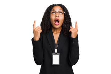 Young african american business woman with ID card isolated pointing upside with opened mouth.
