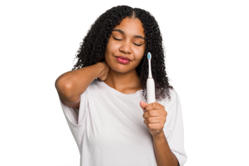 Young african american using a brushing teeth isolated touching back of head, thinking and making a choice.