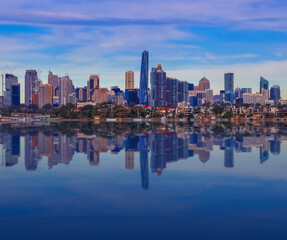 Fototapeta na wymiar Sydney Harbour Australia at Sunset with the reflection of the Buildings and high rise offices of the City in the water