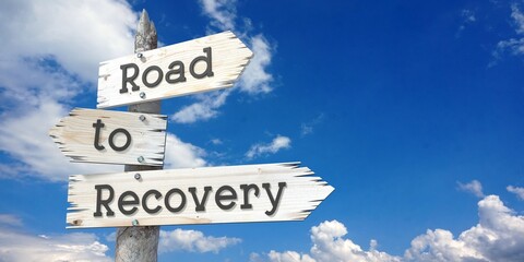 Road to recovery - wooden signpost with three arrows