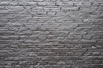 Obraz premium Texture of a black brick wall