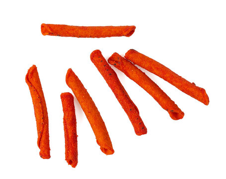 Pile of spicy corn chips isolated on white background. Hot rolled chips.