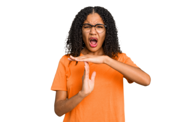 Young african american woman with curly hair cut out isolated showing a timeout gesture.