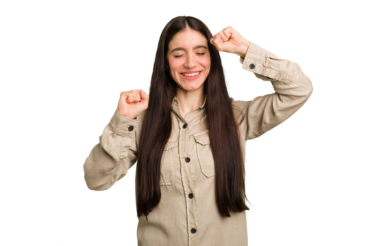 Young caucasian brunette long hair woman cutout isolated celebrating a special day, jumps and raise arms with energy.