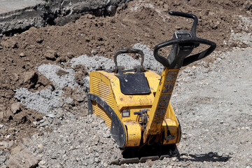 Small construction machine outdoors for public place reconstruction.