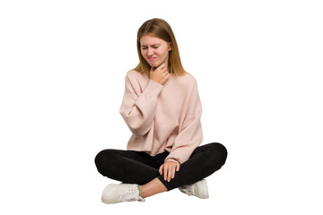 Young caucasian woman sitting on the floor cutout isolated