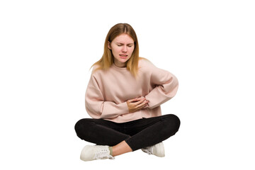 Young caucasian woman sitting on the floor cutout isolated