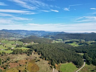 Fototapeta na wymiar Aerial drone panoramic view on the top of the Kaysersberg Valley, towards Orbey and Labaroche, from the Col de Wettstein in Alsace, by cloudy summer weather, with Vosges green forest and mountains