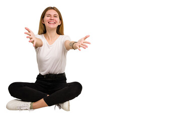 Young caucasian woman sitting on the floor cutout isolated