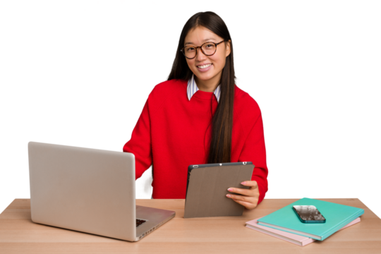 Young student asian woman in a workplace with a laptop isolated