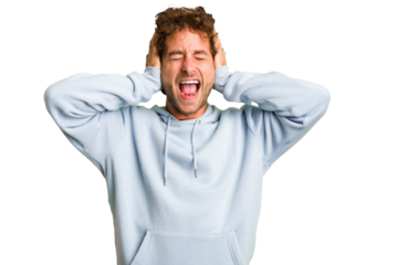 Young curly smart caucasian man cut out isolated covering ears with hands trying not to hear too loud sound.