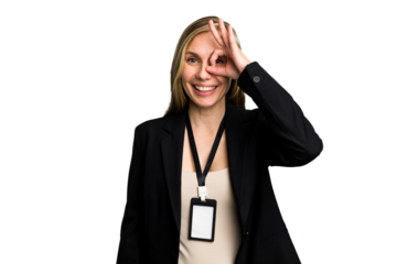Young caucasian business woman with ID card isolated excited keeping ok gesture on eye.