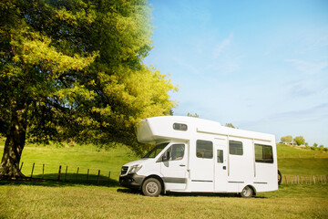 motorhome, caravan or campervan on natural background, vanlife concept, road trip idea. High quality photo
