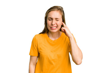 Fototapeta premium Young caucasian woman cutout isolated covering ears with fingers, stressed and desperate by a loudly ambient.