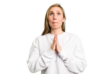 Young caucasian woman cutout isolated holding hands in pray near mouth, feels confident.