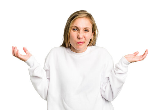 Young caucasian woman cutout isolated doubting and shrugging shoulders in questioning gesture.