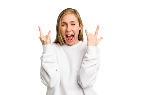 Young caucasian woman cutout isolated showing a horns gesture as a revolution concept.