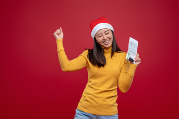 Cute smiling woman holding a barcode in hands