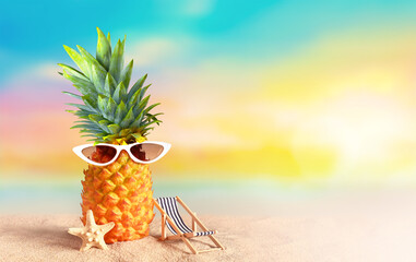 Pineapple with sunglasses on tropical beach background. Summer beach concept. - 553184994