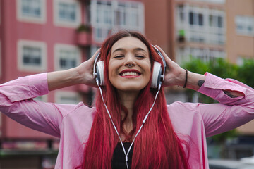 urban woman on the street with headphones