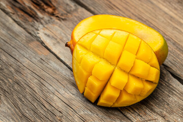Mango tropical fruit on wooden background. superfood concept