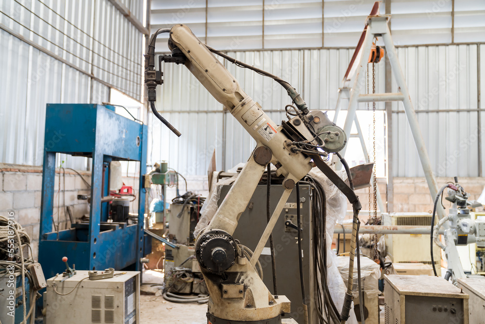Poster automatic robot arm system welding machine in the industry factory. industry robot manufacturing tec