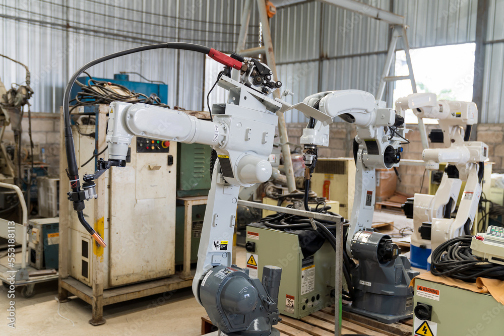 Aufkleber automatic robot arm system welding machine in the industry factory. industry robot manufacturing tec