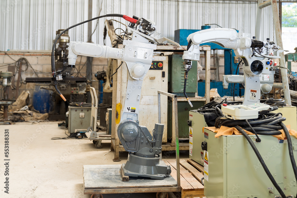 Poster automatic robot arm system welding machine in the industry factory. industry robot manufacturing tec
