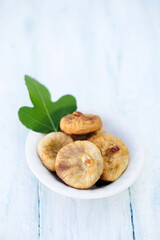 Delicious healthy dried figs with a fig tree leaf