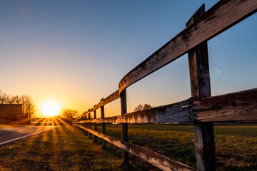 Broomes Island, Maryland USA Sunset over the Patuxent river and field with fences. © Alexander