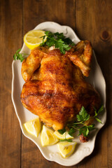 baked chicken with lemon on a plate